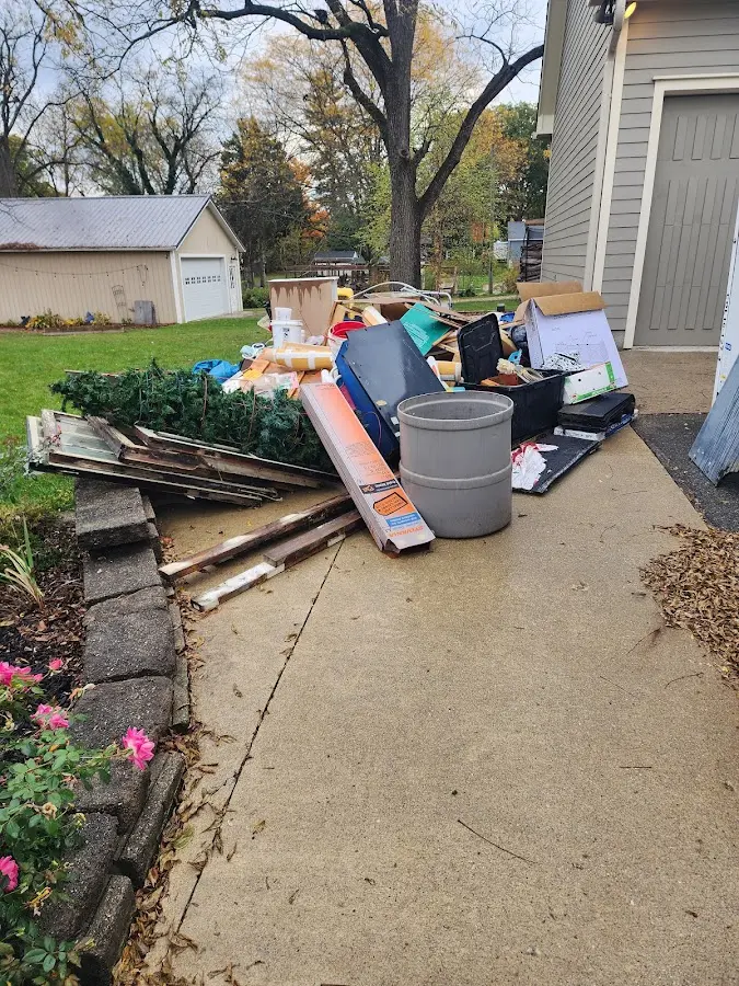 Dumpster being loaded with debris for 12 Yard Dumpster Rental in Park Forest